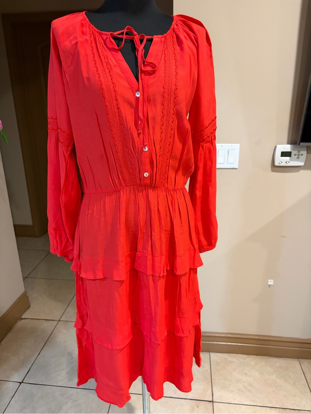 Red tiered dress with lace detailing